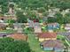 Aerial view of a well-maintained home in a lush, green neighborhood at 3406 Regner Dr, Plant City, FL 33566