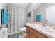 Well-lit bathroom featuring a shower-tub combo, framed mirror, single sink vanity and decorative accents at 3406 Regner Dr, Plant City, FL 33566