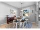 Dining area featuring a table with benches, natural light, and stylish decor, creating a cozy atmosphere at 3406 Regner Dr, Plant City, FL 33566