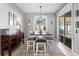 Dining area featuring a table with benches, a window view, and sliding glass doors to the patio at 3406 Regner Dr, Plant City, FL 33566
