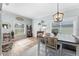 Bright dining room featuring hardwood floors, a large window, and stylish furniture at 3406 Regner Dr, Plant City, FL 33566