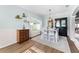 Bright dining room featuring hardwood floors, large window, and stylish furniture at 3406 Regner Dr, Plant City, FL 33566