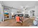 Living room featuring hardwood floors, gray walls, black sectional sofa, and stylish decor at 3406 Regner Dr, Plant City, FL 33566