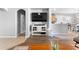 Open-concept living room view, showing hardwood floors, neutral walls, and seamless transition to other spaces at 3406 Regner Dr, Plant City, FL 33566