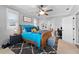 Inviting main bedroom featuring a ceiling fan and an adjacent office area at 3406 Regner Dr, Plant City, FL 33566