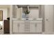 Bathroom with double vanity, modern faucets, and white cabinets, creating a clean and functional space at 3475 Silent Gardens Cv, Wesley Chapel, FL 33543
