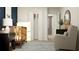 Comfortable Bedroom with crib, rocking chair and storage at 3475 Silent Gardens Cv, Wesley Chapel, FL 33543