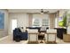 Inviting living room with comfortable seating, natural light, and stylish decor, creating a cozy atmosphere at 3475 Silent Gardens Cv, Wesley Chapel, FL 33543