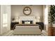 Serene primary bedroom featuring a plush bed, stylish lamps, and a calming color scheme at 3475 Silent Gardens Cv, Wesley Chapel, FL 33543