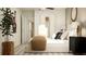Bright and airy bedroom featuring a comfortable bed, storage and artwork at 3475 Silent Gardens Cv, Wesley Chapel, FL 33543