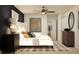Serene main bedroom with neutral tones, plush bedding, and elegant decor, offering a relaxing retreat at 3475 Silent Gardens Cv, Wesley Chapel, FL 33543