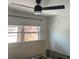 Bedroom with ceiling fan, window, and exposed infrastructure ready for remodel at 3514 Gulf # 2, St Petersburg, FL 33706