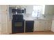 Efficient kitchen layout with appliances, cabinets, and countertops at 37648 Campo Ave, Zephyrhills, FL 33541