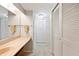 Well-lit bathroom vanity, mirrored wall, and spacious closets offering ample storage at 4006 Cypress Lane #4006 # 4006, Tampa, FL 33618