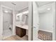 Functional bathroom features a vanity with a sink and a separate toilet room at 4006 Cypress Lane #4006 # 4006, Tampa, FL 33618