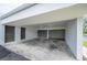 Attached carport with a private entry door offers convenient parking and protection from the elements at 4006 Cypress Lane #4006 # 4006, Tampa, FL 33618