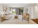 Bright living room features stylish furnishings, natural light, and seamless access to the outdoor patio area at 4006 Cypress Lane #4006 # 4006, Tampa, FL 33618