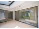 Screened patio with sliding glass doors provides serene views of the lush backyard at 4006 Cypress Lane #4006 # 4006, Tampa, FL 33618
