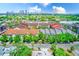 Beautiful aerial view of townhomes with a lovely landscape and Tampa skyline in the background on a sunny day at 402 S Armenia Ave # 139A, Tampa, FL 33609