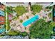 Overhead shot of the community pool, lounge areas, and lush landscaping at 402 S Armenia Ave # 139A, Tampa, FL 33609