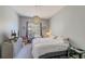 Cozy bedroom with a large window, dresser, and comfortable bed at 402 S Armenia Ave # 139A, Tampa, FL 33609