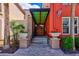 Charming building entrance featuring a covered walkway, planters, and brick pavers at 402 S Armenia Ave # 139A, Tampa, FL 33609