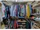 Walk-in closet featuring shelving and plenty of hanging space for clothes and accessories at 402 S Armenia Ave # 139A, Tampa, FL 33609