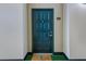 A dark green door with a decorative knocker and unit number welcomes visitors with a fun doormat at 402 S Armenia Ave # 139A, Tampa, FL 33609
