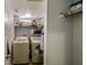 Laundry room features a washer, dryer, storage shelving, and ample space for organizing household chores at 402 S Armenia Ave # 139A, Tampa, FL 33609
