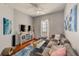 Comfortable living room featuring a sectional sofa, stylish rug, and ample natural light at 402 S Armenia Ave # 139A, Tampa, FL 33609