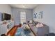 Cozy living room with a comfortable sofa, hardwood floors, and a bright window at 402 S Armenia Ave # 139A, Tampa, FL 33609