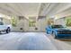 Well-lit parking garage featuring marked spaces, natural light, and views of lush greenery at 402 S Armenia Ave # 139A, Tampa, FL 33609