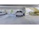 Parking garage area with painted walls, parking spot labels, and stairs to the building at 402 S Armenia Ave # 139A, Tampa, FL 33609