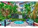 Tranquil spa area surrounded by lush tropical plants and featuring a bubbling hot tub at 402 S Armenia Ave # 139A, Tampa, FL 33609