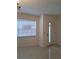 Inviting entryway featuring tile flooring, a bright window, and a modern front door at 406 Bullard Pkwy, Temple Terrace, FL 33617
