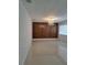 Bright living room with a decorative chandelier, tile floor, and brick accent wall at 406 Bullard Pkwy, Temple Terrace, FL 33617