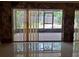 Enclosed Patio with sliding glass doors and ceramic tile flooring at 406 Bullard Pkwy, Temple Terrace, FL 33617