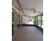 Spacious outdoor patio featuring concrete flooring, a ceiling fan, and large glass doors at 406 Bullard Pkwy, Temple Terrace, FL 33617