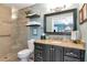 A modern bathroom featuring a glass shower and granite vanity at 4125 W Obispo St, Tampa, FL 33629