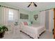 A relaxing bedroom with soft colors and natural light from the window at 4125 W Obispo St, Tampa, FL 33629