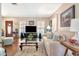 Comfortable living room with hardwood floors, large windows, plush sofa, and stylish decor, perfect for relaxation at 4125 W Obispo St, Tampa, FL 33629