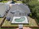 Aerial view of the home showcasing a screened-in pool area and a well-maintained backyard and privacy fence at 4401 Arranmore Cir, Valrico, FL 33596