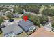 Aerial view of the property featuring a screened pool and surrounding landscape at 4401 Arranmore Cir, Valrico, FL 33596