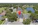 The area features lush trees and a tranquil lake, enhancing its appeal at 4401 Arranmore Cir, Valrico, FL 33596
