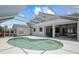 An elevated view showcases the pool, screened in lanai, and patio area at 4401 Arranmore Cir, Valrico, FL 33596