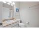 This bathroom features granite countertops, white cabinets, and a shower at 4401 Arranmore Cir, Valrico, FL 33596