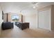 This bonus room features neutral carpeting and paint, ceiling fans, natural light, and ample closet space at 4401 Arranmore Cir, Valrico, FL 33596