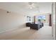 Large bonus room with neutral colors, plush carpet, and lots of seating at 4401 Arranmore Cir, Valrico, FL 33596