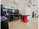 Spacious game room featuring tile floors and various gaming and arcade machines at 4401 Arranmore Cir, Valrico, FL 33596