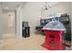 Bright game room equipped with arcade games and recessed lighting at 4401 Arranmore Cir, Valrico, FL 33596